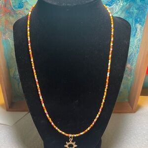 Colorful Beaded Necklace with Sun Charm